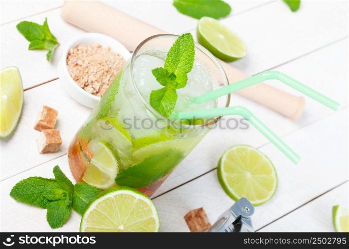 Mojito cocktail on wooden table closeup