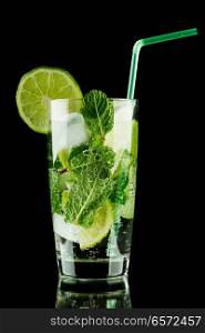 Mojito cocktail with lime, mint and ice on black background 