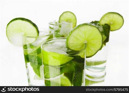Mojito cocktails with lime and mint isolated on white background. Mojito cocktails