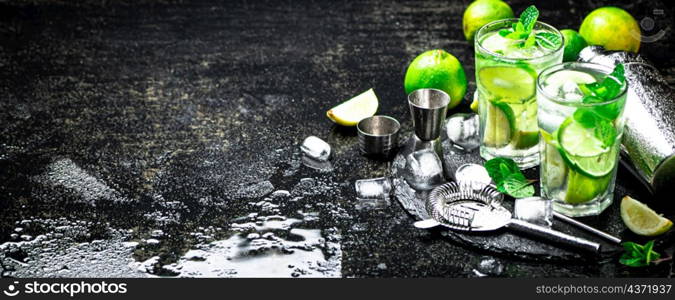 Mojito on a stone board. On a black background. High quality photo. Mojito on a stone board.