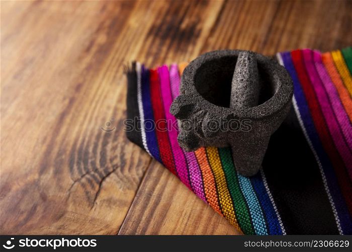 Molcajete. Traditional mexican version of mortar and pestle handmade of volcanic stone. Essential element in the preparation of the authentic Mexican sauce and other dishes.