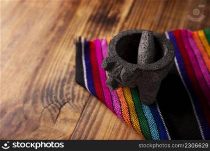 Molcajete. Traditional mexican version of mortar and pestle handmade of volcanic stone. Essential element in the preparation of the authentic Mexican sauce and other dishes.