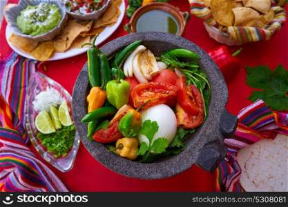 Molcajete with chili for chile ranchera sauce from Mexico