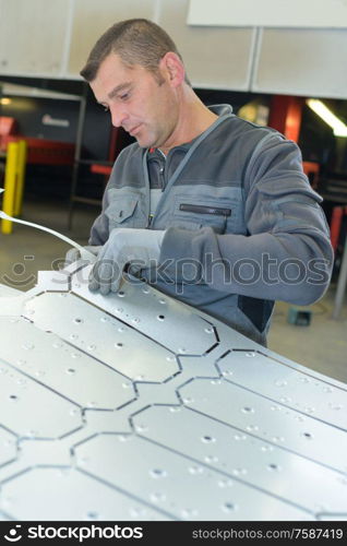 molding metal sheets in factory
