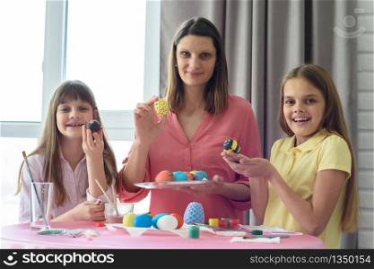 Mom and children show what beautiful Easter eggs they got