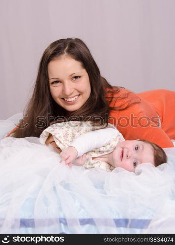 Mom and daughter on the couch six-month