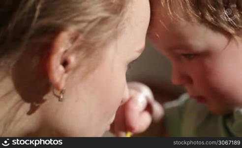 Mom and her son kissing. Lovely close ups.