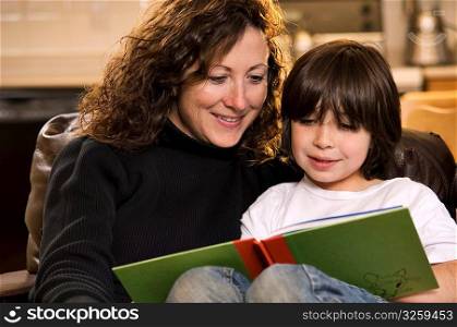Mom and son reading a book.