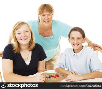 Mom and two kids have fun playing board games. Isolated on white.
