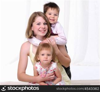 Mom, her son and her little daughter together having fun