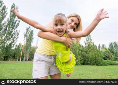 Mom keeps daughter in her arms and rocking