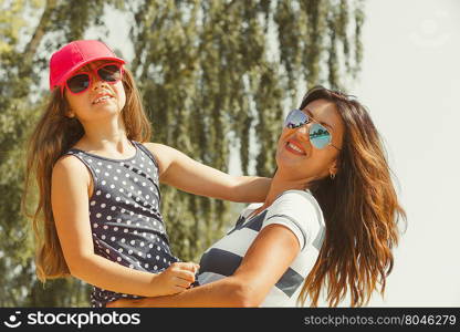 Mommy and daughter spending lovely time together.. Love and good feelings in family. Childhood and parenthood concept. Lovely cute girl and woman in summer holidays. Adorable mommy and her child daughter together.