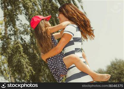 Mommy and daughter spending lovely time together.. Love and good feelings in family. Childhood and parenthood concept. Lovely cute girl and woman in summer holidays. Adorable mommy and her child daughter together.