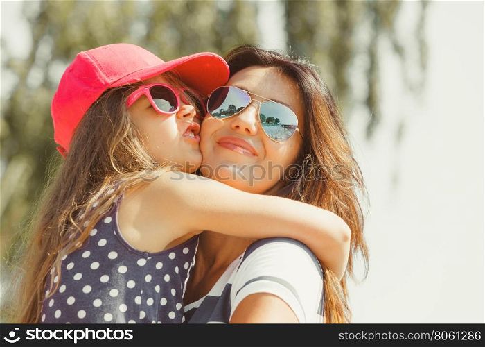 Mommy and daughter spending lovely time together.. Love and good feelings in family. Childhood and parenthood concept. Lovely cute girl and woman in summer holidays. Adorable mommy and her child daughter together.