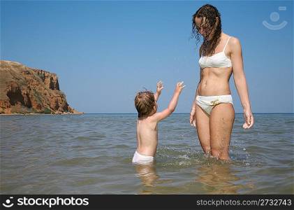 Mommy with daughter in sea