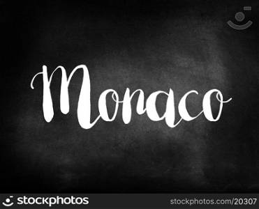 Monaco written on a blackboard