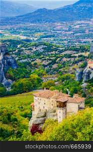 Monasteries on cliff in Meteora, Monastery of Rousanou and St. Nicholas Anapausas, Thessaly Greece. Greek destinations. Monasteries in Meteora, Greece