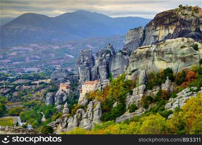 Monasteries on cliff in Meteora, Monastery of Rousanou and St. Nicholas Anapausas, Thessaly Greece. Greek destinations. Monasteries in Meteora, Greece