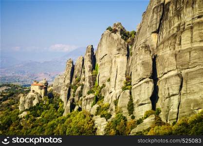 Monasteries on cliff in Meteora, Monastery of St. Nicholas Anapausas, Thessaly Greece. Greek destinations. Monastery of St. Nicholas Anapausas in Meteora, Greece