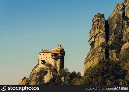 Monasteries on cliff in Meteora, Monastery of St. Nicholas Anapausas, Thessaly Greece. Greek destinations. Monastery of St. Nicholas Anapausas in Meteora, Greece