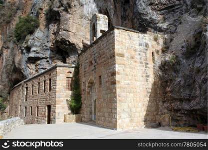 Monastery near rock in Quadisha valley in Lebanon