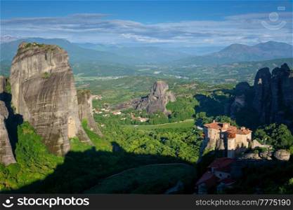 Monastery of Rousanou and Monastery of St. Nicholas Anapavsa in famous greek tourist destination Meteora in Greece in the morning. Monasteries of Meteora, Greece