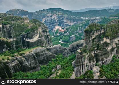 Monastery of Varlaam and Monastery of Rousanou and Monastery of Great Meteoron in famous greek tourist destination Meteora in Greece with scenic scenery landscape. Monasteries of Meteora, Greece