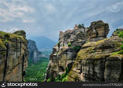 Monastery of Varlaam in famous greek tourist destination Meteora in Greece on sunset with scenic scenery landscape. Monasteries of Meteora, Greece