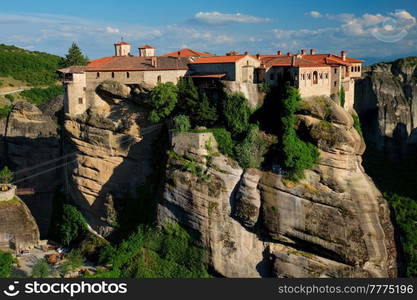 Monastery of Varlaam monastery in famous greek tourist destination Meteora in Greece on sunset with scenic scenery landscape. Monasteries of Meteora, Greece