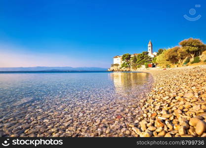 Monastery on pebble beach in Bol, island of Brac, Dalmatia, Croatia