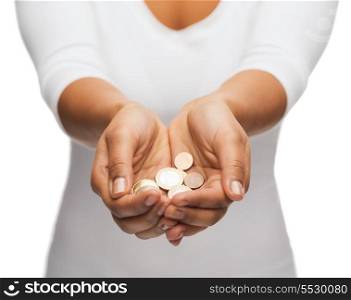 money and finances concept - close up of womans cupped hands showing euro coins
