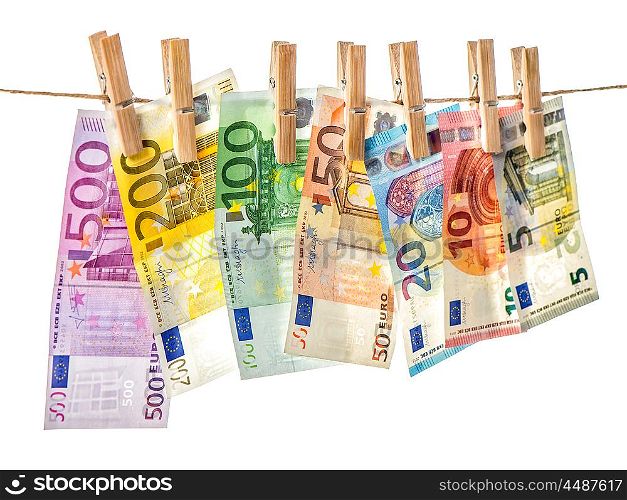 Money background. Euro banknotes hanging a rope with clothes pins. Selective focus