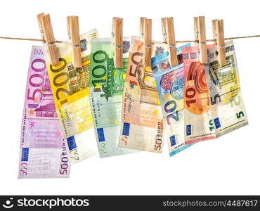 Money background. Euro banknotes hanging a rope with clothes pins. Selective focus