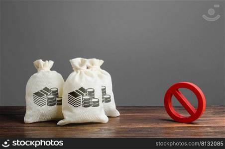 Money bags and red prohibition sign no. Restrictions on the export of capital, Economic pressure and sanctions. Lack of investment and inflow of finance. Regulatory laws in the financial sector.