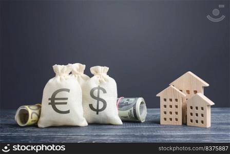 Money bags and residential buildings figures. Real estate investment, construction and housing purchase. Financing construction projects from the state budget. Subsidies. Taxes. House renovation
