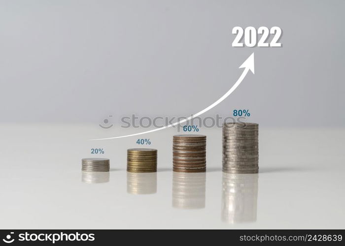 Money coin stack growing graph and a tree that grows on a pile of money, The idea of business finance and saving money investment and Growing Money, Tree growing up on coins