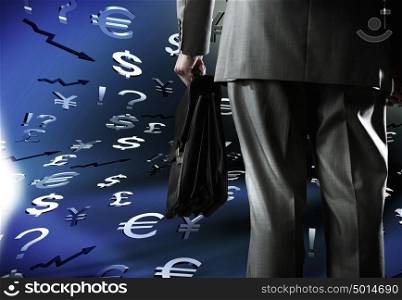 Money concept. Bottom view of businessman with suitcase in hand