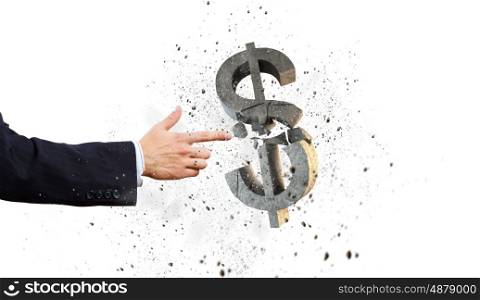 Money concept. Businessman breaking dollar stone symbol with finger touch