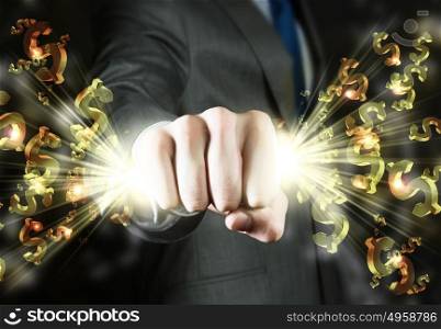 Money concept. Close up of businessman hand clenching dollar signs in fist