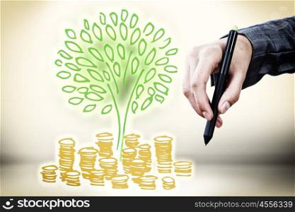 Money concept. Close up of businessman hand drawing money tree
