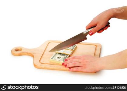 Money concept - cutting dollars with the knife