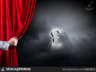 Money concept. Hand of businessman opening red velvet curtain