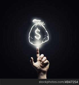 Money concept. Human hand pointing with finger at money sign