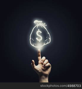 Money concept. Human hand pointing with finger at money sign