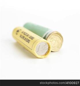 Money concept. Rolls of Euro coins on white