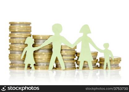 Money concepts. Paper family and stacks of coins on white background