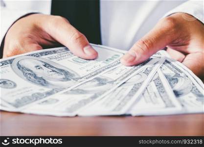 Money Dollar bills in Hand Businessman