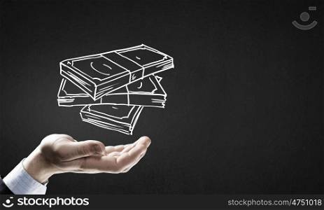 Money earning. Businessman hand holding drawn banknotes in palm