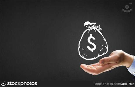 Money earning. Businessman hand holding drawn money bag in palm