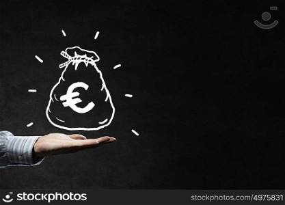 Money earning. Businessman hand holding drawn money bag in palm